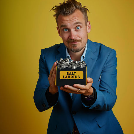A Danish boss holds out salt licorice to a new international hire